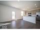 Open kitchen with stainless appliances, center island and plenty of sunlight from the adjacent dining area at 1567 Hanover St, Danville, IN 46122