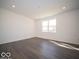 Spacious open living room with modern flooring and ample natural light from a bright window at 1567 Hanover St, Danville, IN 46122