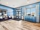 A stylish entrance foyer with contemporary blue decor, window blinds, and chic furniture accents at 1567 Hanover St, Danville, IN 46122