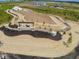 Aerial view of the community entrance with a horse logo. There is a barn under construction in the distance at 1574 Hanover St, Danville, IN 46122