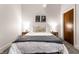 Bright bedroom with a plush bed, minimalist decor, and natural light at 233 E Saint Joseph St # 3E, Indianapolis, IN 46202