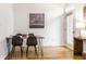 Bright dining area with a table and four chairs, and art on the wall at 233 E Saint Joseph St # 3E, Indianapolis, IN 46202