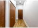 Hallway with hardwood floors and two wooden doors in the apartment unit at 233 E Saint Joseph St # 3E, Indianapolis, IN 46202