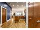 Open floor plan with hardwood floors, kitchen island and stainless steel appliances at 233 E Saint Joseph St # 3E, Indianapolis, IN 46202