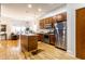 Kitchen features a kitchen island, stainless steel appliances, and hardwood floors at 233 E Saint Joseph St # 3E, Indianapolis, IN 46202