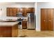Kitchen featuring stainless steel appliances, wood cabinets, and hardwood flooring at 233 E Saint Joseph St # 3E, Indianapolis, IN 46202