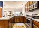 Kitchen with stainless steel appliances, wooden cabinets, a kitchen island, and an open layout at 233 E Saint Joseph St # 3E, Indianapolis, IN 46202