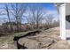 A newly constructed home showcasing its spacious backyard and tree line at 3917 Holly Brook Dr, Westfield, IN 46062