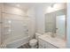 Clean bathroom featuring a shower-tub combo, toilet, and vanity with modern fixtures and storage at 3917 Holly Brook Dr, Westfield, IN 46062