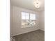 Bedroom boasting neutral carpet, bright walls, and natural lighting coming from a window with a view of the neighborhood at 3917 Holly Brook Dr, Westfield, IN 46062