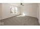 Spacious bedroom with neutral carpet, ceiling fan, and windows allowing natural light to illuminate the interior at 3917 Holly Brook Dr, Westfield, IN 46062