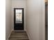 Well-lit entryway featuring a glass-paneled door and stylish wood-look flooring at 3917 Holly Brook Dr, Westfield, IN 46062