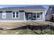A new home featuring a gray siding, white trim, and a covered patio area at 3917 Holly Brook Dr, Westfield, IN 46062