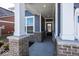 Inviting front porch with brick pillars, providing a warm welcome into the home at 3917 Holly Brook Dr, Westfield, IN 46062