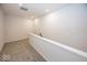 Upstairs hallway boasting new carpet, white walls, and a staircase at 3917 Holly Brook Dr, Westfield, IN 46062