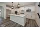 Bright kitchen with a large island, stainless steel appliances, and stylish pendant lighting at 3917 Holly Brook Dr, Westfield, IN 46062