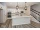 Modern kitchen with white cabinets, quartz countertops, and stainless steel appliances at 3917 Holly Brook Dr, Westfield, IN 46062