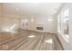 Bright living room featuring a sleek fireplace and large windows offering abundant natural light at 3917 Holly Brook Dr, Westfield, IN 46062