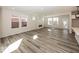 Spacious living room with modern flooring and ample natural light from large windows at 3917 Holly Brook Dr, Westfield, IN 46062