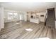Open concept living space with a view of the modern kitchen and staircase at 3917 Holly Brook Dr, Westfield, IN 46062