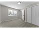 Well-lit bedroom with neutral walls, new carpet, and closet at 4445 Cherry Ln, Indianapolis, IN 46228