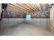 Unfinished basement with exposed beams and a window for natural light at 4958 Reavie Ct, Noblesville, IN 46062