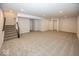 Unfinished basement featuring neutral carpeting and stairs at 4958 Reavie Ct, Noblesville, IN 46062
