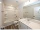 Clean bathroom with shower/tub combo, white cabinets, and vinyl flooring at 4958 Reavie Ct, Noblesville, IN 46062