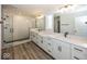 Modern bathroom with double vanity, walk-in shower, and white cabinets at 4958 Reavie Ct, Noblesville, IN 46062