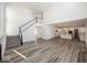 Open concept great room with hardwood floors, high ceilings, and kitchen view at 4958 Reavie Ct, Noblesville, IN 46062