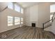 Two-story great room featuring a fireplace and hardwood floors at 4958 Reavie Ct, Noblesville, IN 46062