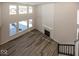 High ceiling great room with hardwood floors, fireplace and staircase at 4958 Reavie Ct, Noblesville, IN 46062