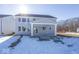 Two-story house with gray siding, covered patio and snowy yard at 4958 Reavie Ct, Noblesville, IN 46062