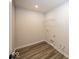 Laundry room with wire shelving and vinyl flooring at 4958 Reavie Ct, Noblesville, IN 46062