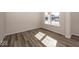 Sunlit living room showcasing hardwood floors and neutral walls at 4958 Reavie Ct, Noblesville, IN 46062