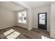 Bright and spacious living room with hardwood floors and large windows at 4958 Reavie Ct, Noblesville, IN 46062
