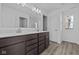 Bathroom with double sink vanity and a large framed mirror at 5127 Rolling Meadow Blvd, Indianapolis, IN 46237