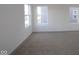 Bright bedroom with neutral walls, carpet, and windows at 5127 Rolling Meadow Blvd, Indianapolis, IN 46237