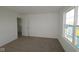 Spacious bedroom with carpeted floor and large window at 5127 Rolling Meadow Blvd, Indianapolis, IN 46237