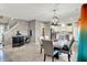 Elegant dining room with stylish table, seating for six, and a view into the modern kitchen at 7062 English Oak Dr, McCordsville, IN 46055