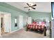 Spacious main bedroom features a ceiling fan, ensuite bathroom, and ample closet space at 7062 English Oak Dr, McCordsville, IN 46055