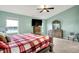 Spacious main bedroom features a ceiling fan, ensuite bathroom, and a view of the lake at 7062 English Oak Dr, McCordsville, IN 46055