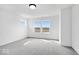 Well-lit bedroom with neutral carpet, two large windows, and ample space for a comfortable living arrangement at 16043 Meadow Frost Ct, Fishers, IN 46037