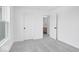 Comfortable bedroom with gray carpet and white walls, adjacent to a bathroom at 16043 Meadow Frost Ct, Fishers, IN 46037