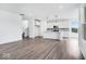 Open-concept kitchen featuring white cabinets, a center island, and modern stainless appliances at 16043 Meadow Frost Ct, Fishers, IN 46037