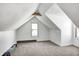 Charming attic bedroom with sloped ceilings and window at 2123 Pamela Dr, Indianapolis, IN 46220