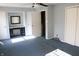 Bedroom with blue carpet, gray walls, a ceiling fan, and a built-in desk at 406 S Fenton Ave, Indianapolis, IN 46219