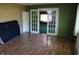 Living room featuring hardwood floors and glass French doors into the next room at 406 S Fenton Ave, Indianapolis, IN 46219