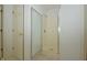 This bathroom features a glass enclosed standing shower with white tile and a door to the left at 5250 Shamus Dr, Indianapolis, IN 46235