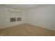 Simple carpeted bedroom featuring a window and neutral walls at 5250 Shamus Dr, Indianapolis, IN 46235